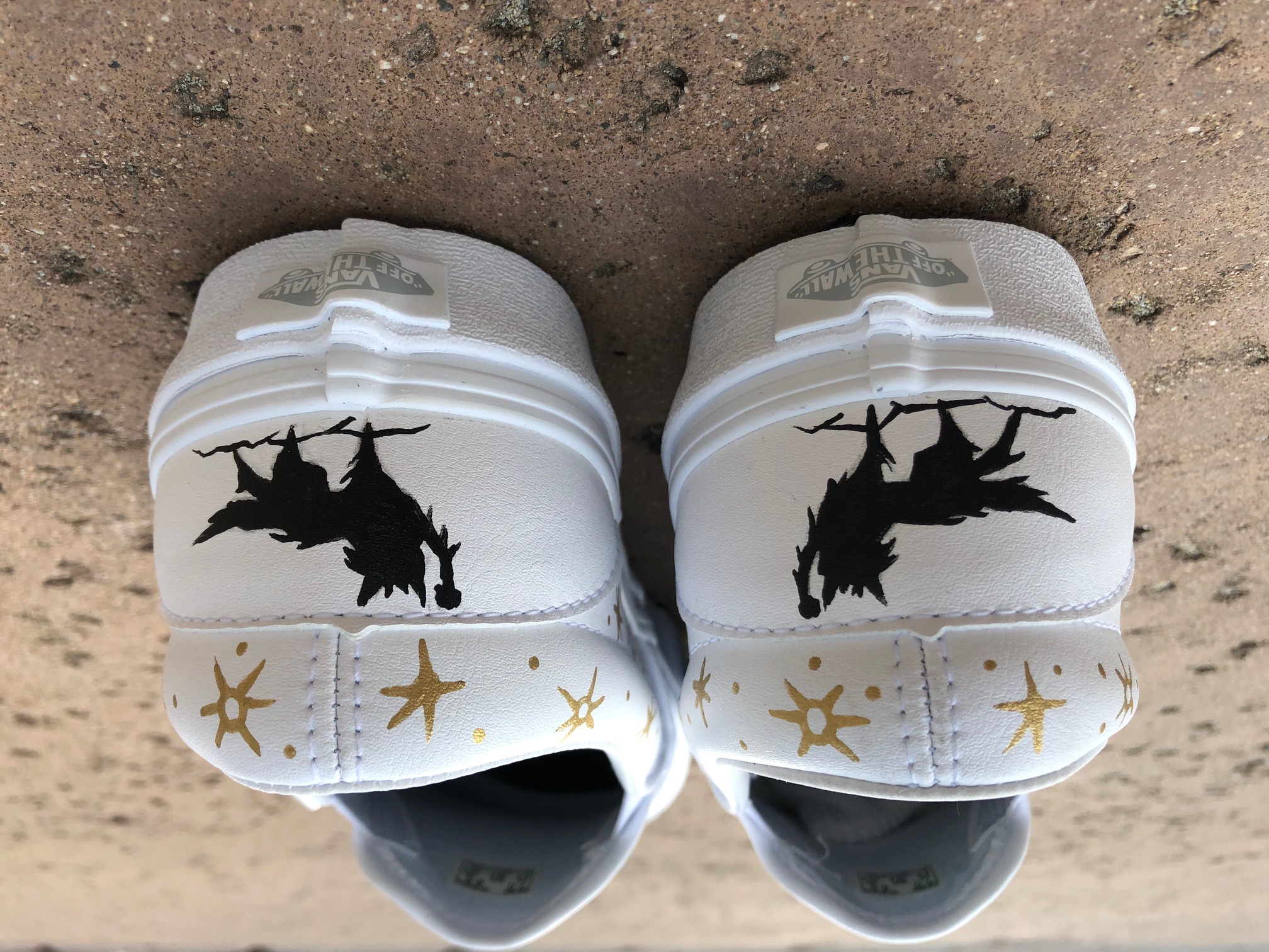 white shoes with designs on the back